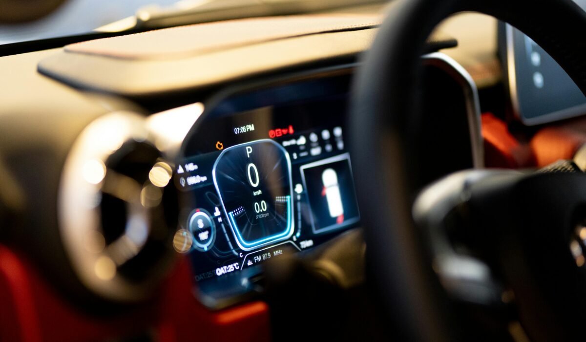 Close-up of illuminated car dashboard interior showing digital displays in Dubai showroom. — Photo by Atul Mohan on Pexels