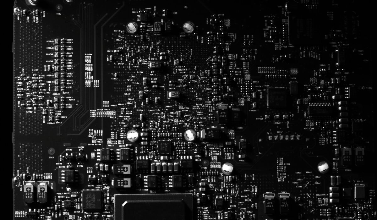 Detailed black and white photo of a circuit board showing intricate components, perfect for tech projects. — Photo by Miguel Á. Padriñán on Pexels