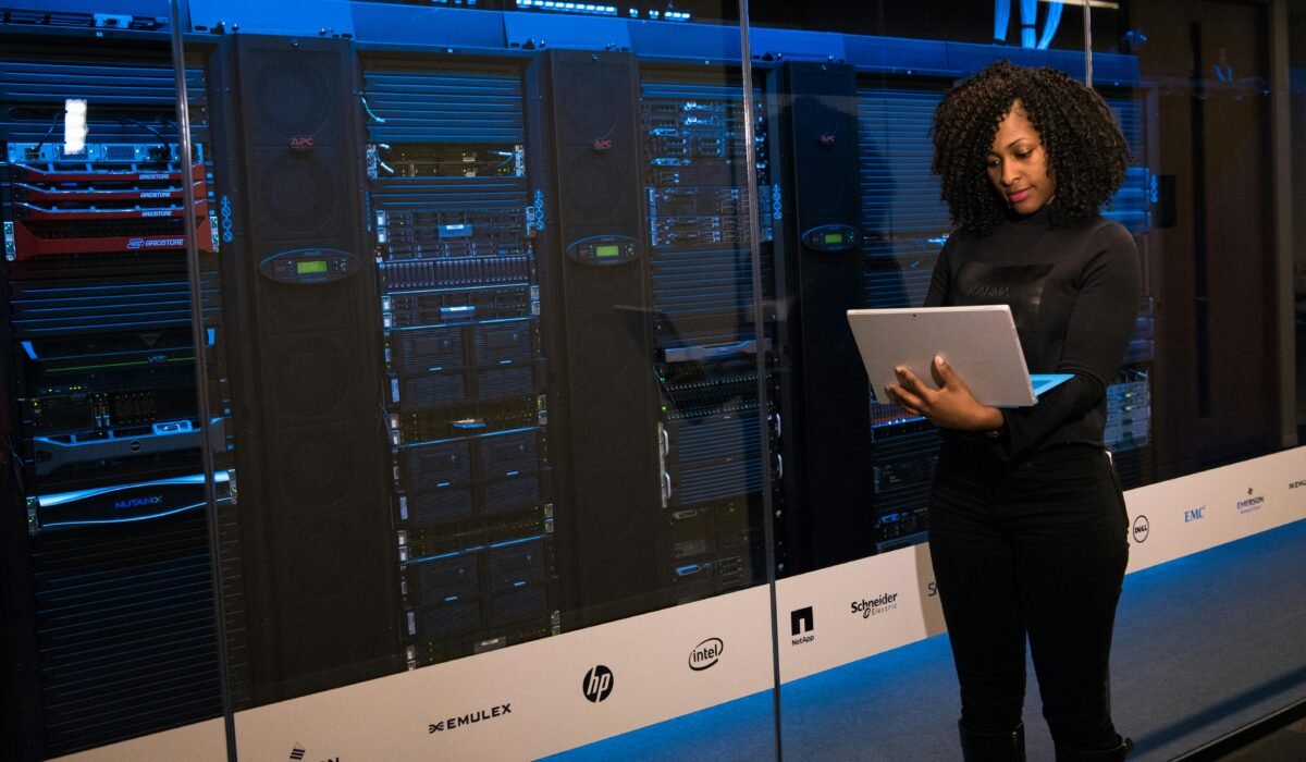 A female engineer using a laptop while monitoring data servers in a modern server room. — Photo by Christina Morillo on Pexels