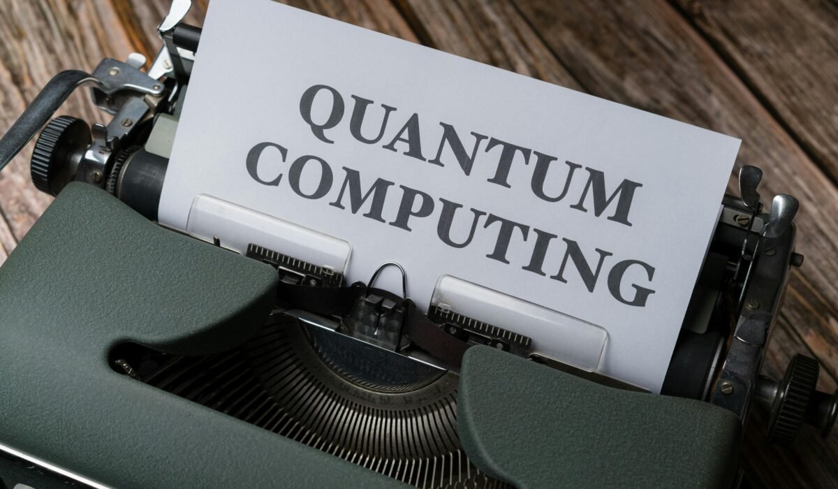 Quantum computing concept displayed on a vintage typewriter on wooden table. — Photo by Markus Winkler on Pexels